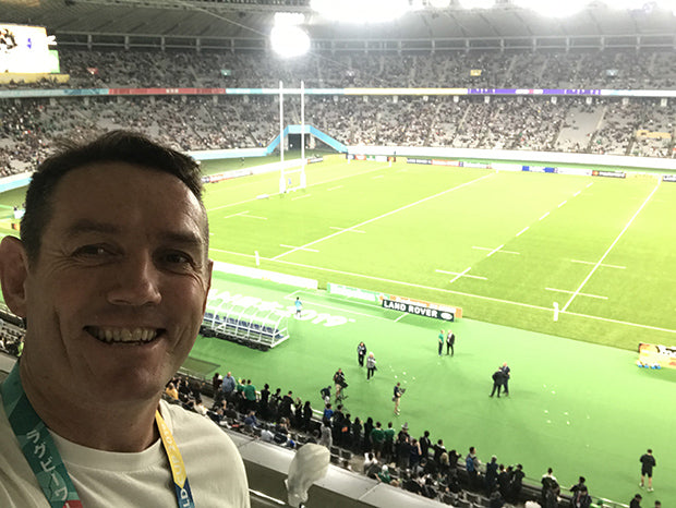 Jim juggles fatherhood with the 4-hour time difference at the Rugby World Cup. 